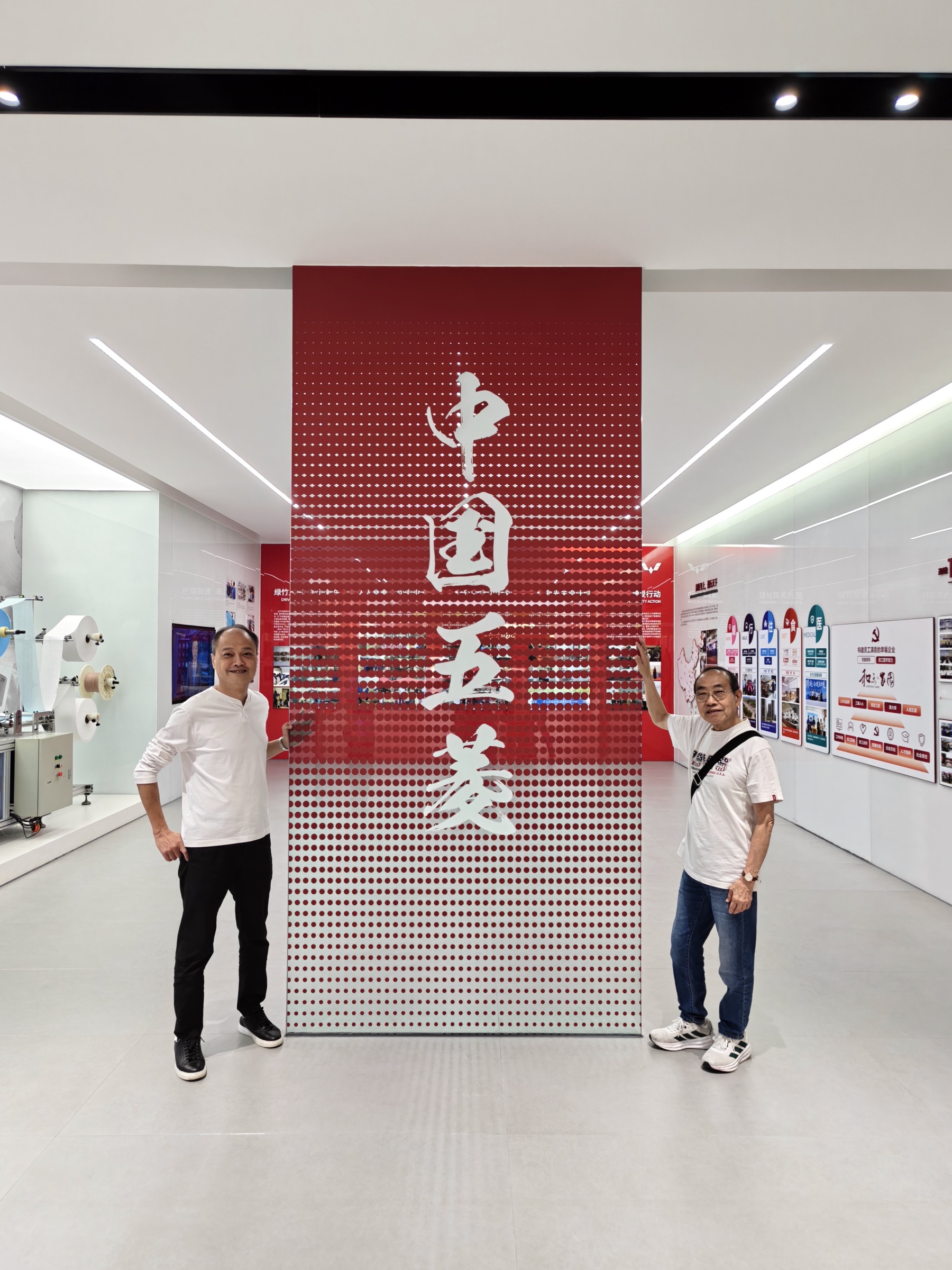 Delegation members at a Wuling exhibition space
